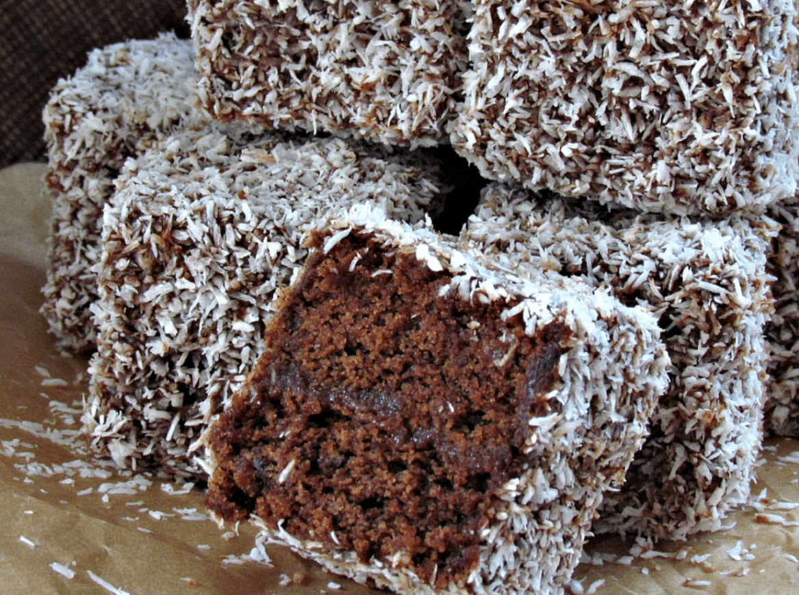 Titelbild für feine Kokosschnitten in Schokolade gewendet